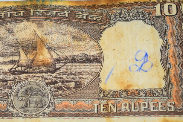 istock Close up view of rare ten rupee note on the table, Old Indian Currency notes on a rotating table, Rare Indian Currency close up view 1386402817
