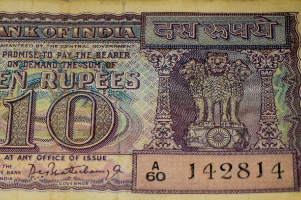 istock Close up view of rare ten rupee note on the table, Old Indian Currency notes on a rotating table, Rare Indian Currency close up view 1386402822