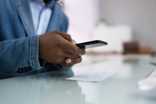 istock Remote Payroll Cheque Deposit Taking Picture 1386403405