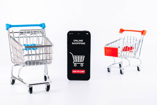 istock Ecommerce application. Digital smartphone with online shop app, shopping trolley on white background. Website retail business concept. Easy ecommerce website shop. 1386404552