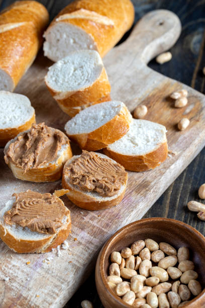 istock peanut paste with pieces of peanuts and white baguette 1386409518