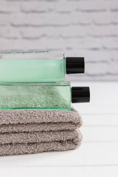 istock Bath stuff beauty concept gray towels vertical front view. 1386417313
