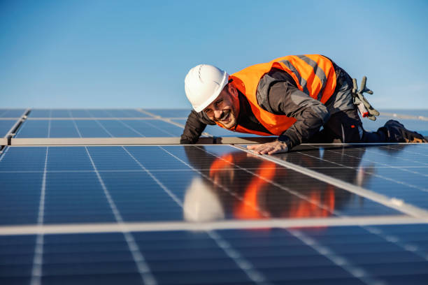 istock A happy worker checking on solar panels if they are straight. 1386418207