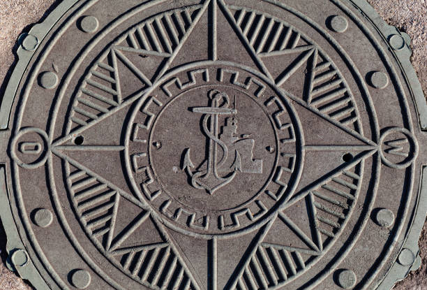 well manhole made of stone with an anchor image