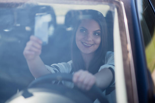 istock Young woman sitting in the car 1386437626