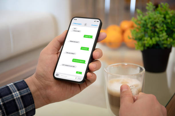 istock male hands holding phone with app messenger on screen 1386442831