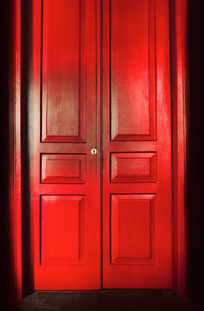 istock red massive vintage doors indoor. Old fashioned interior concept 1386443347
