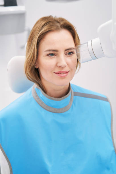 istock Woman using diagnostic equipment in dental clinic 1386446085