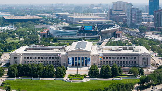 Drone shot of the Field Museum in Chicago with Soldier Field in the background. The Field Museum is a state-of-the-art science museum with the largest Tyrannosaurus Rex.