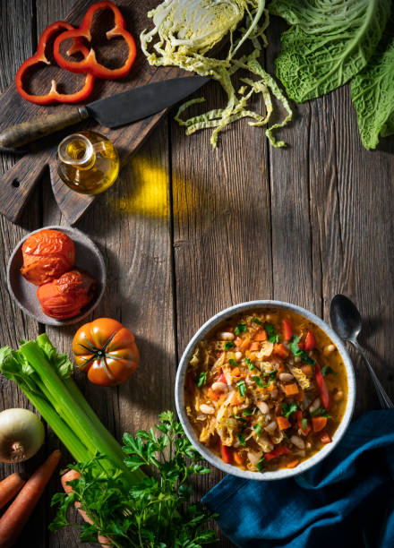 istock Vegetable Cabbage Soup vegan ingredients celery, beans, bell pepper, carrots, parsley and tomatoes 1386448236