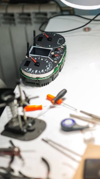 istock Car mechanic working on dashboard electronic circuit boards, stock photo 1386449382