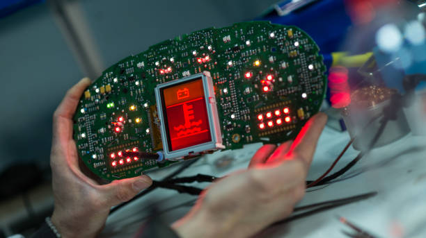 istock Car mechanic working on dashboard electronic circuit boards, stock photo 1386449637