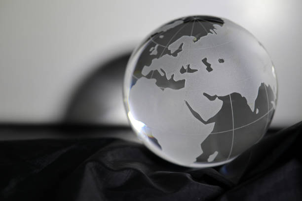 istock grass globe on the black satin fabric 1386451922