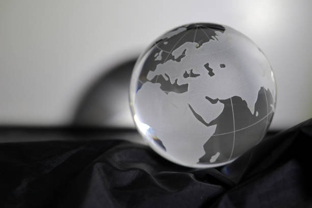 istock grass globe on the black satin fabric 1386451928