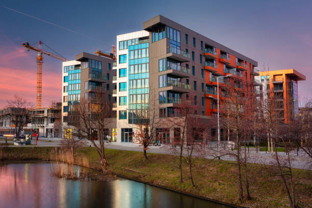 istock Street with new apartments at sunset 1386453890