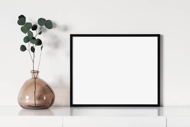 istock Artwork mock-up in interior design. Blank horizontal picture frame on a cupboard 1386454552