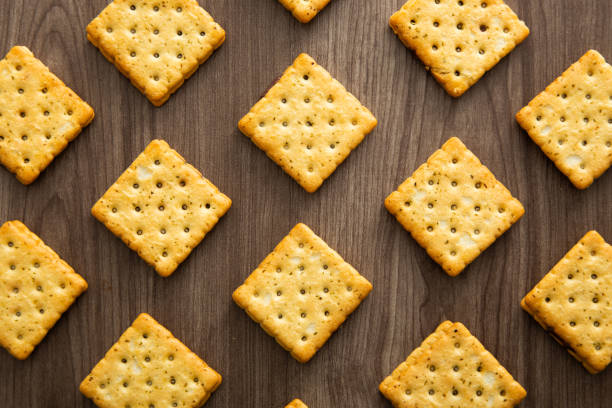 istock Biscuit with chocolate filling on wooden background 1386463839