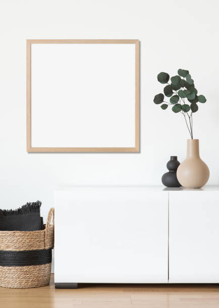 istock Artwork mock-up in interior design. Blank square shaped picture frame on a wall 1386464341