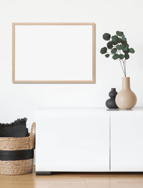 istock Artwork mock-up in interior design. Blank picture frame on a wall 1386464379