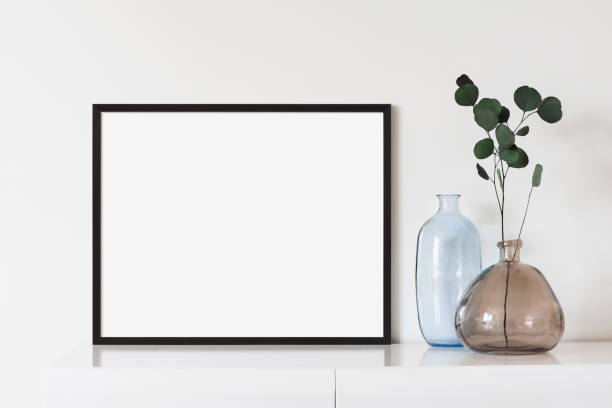 istock Artwork mock-up in interior design. Blank horizontal picture frame on a cupboard 1386464455