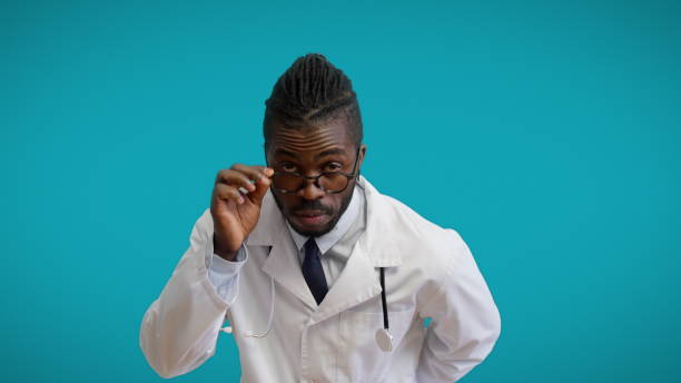Surprised African therapist in eyeglasses looking at camera, unusual case, unknown disease