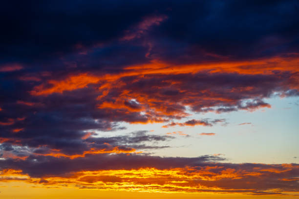 istock dramatic summer evening orange sky, bright colorful sunset 1386472372