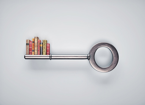 Key with a group of books . Key of knowledge and self development concept . This is a 3d render illustration .\