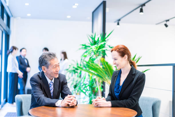 istock Businessperson having a meeting in a hotel lobby 1386477458