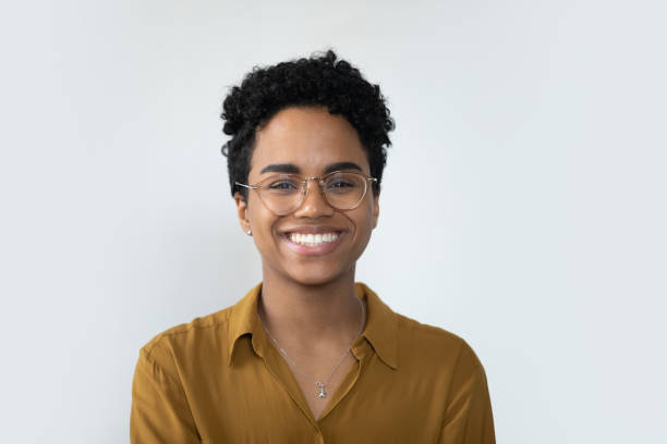 happy millennial afro american business woman posing isolated on white - woman smiling stockfoto's en -beelden