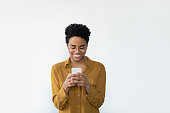 Happy Black woman in casual glasses browsing internet