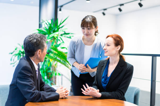 istock Interpreters and secretaries working in an office 1386479412
