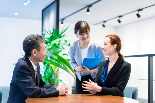 istock Interpreters and secretaries working in an office 1386479413