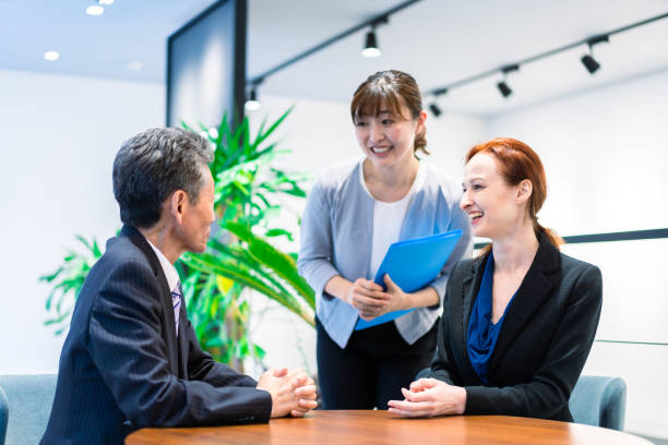 istock Interpreters and secretaries working in an office 1386479424