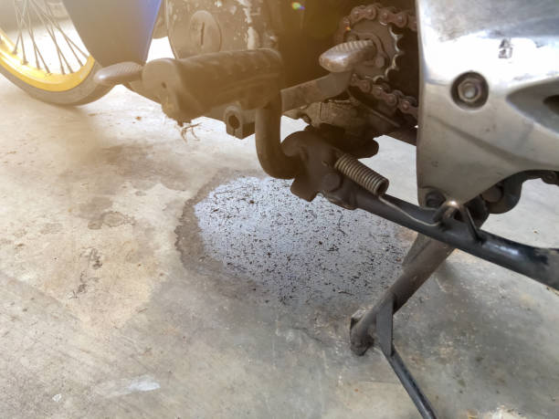 istock Black oil leaks from the engine and needs repair 1386479743