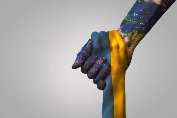 istock world help and support to Ukraine concept. giving a helping hand to partner 1386485367