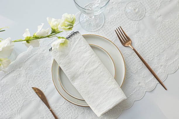 istock empty plate with cutlery and napkin on white background 1386491252