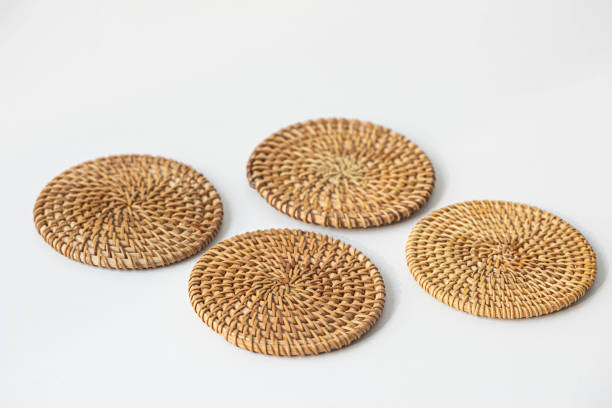 Rattan coasters or drinks mats isolated on a white background stock photo