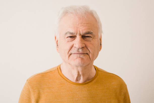 istock Characterful faces of a mature man 1386492805