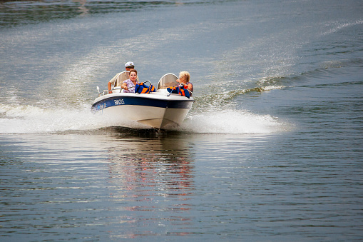 Minsk, Belarus - July, 15: Women on a pleasure boat ride in the breeze and have fun