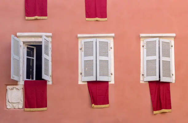 Photo of The red flags on houses in Easter (Island Corfu, Greece)