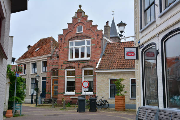 Den Burg, Netherlands - August 31st 2021; Village on Texel Island - traditional Dutch brick buildings in the Old Town