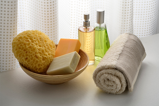 body care products with nourishing oils and towel