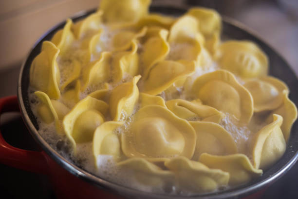 Close Up Homemade Ravioli Floats In A Pot As It Cooks, Preparation Of Italian Pasta, Selective Focus
