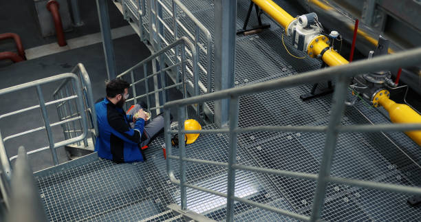 istock A millennial worker sits on the steps and eats a healthy salad in a heating plant. 1386501843