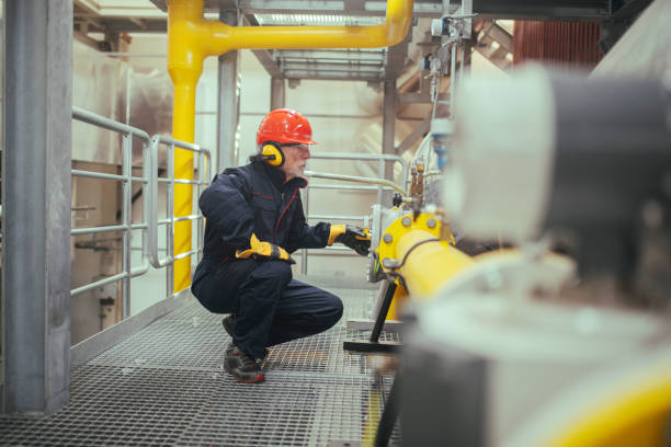 istock Industrial worker working in industry plant. 1386501854