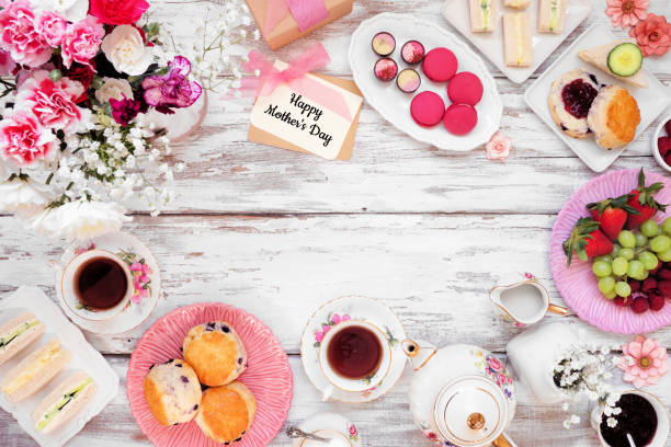 istock Mother's Day tea frame over a white wood background 1386505436