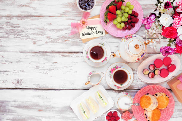 istock Mother's Day tea side border against a white wood background 1386505468