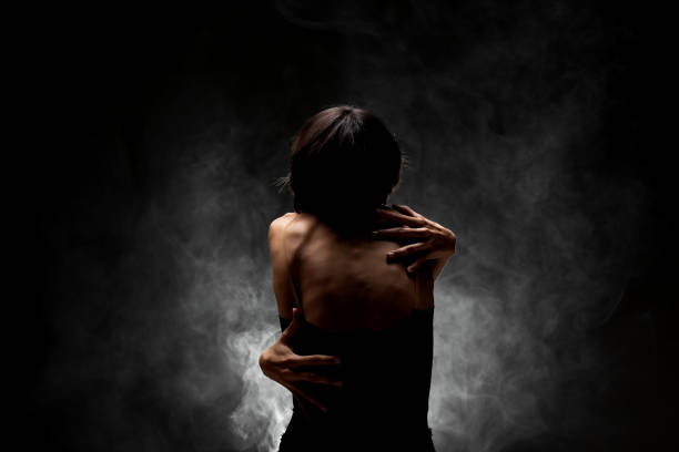 istock half silhouette modern ballet dancer posing on dark background with smoke 1386507680