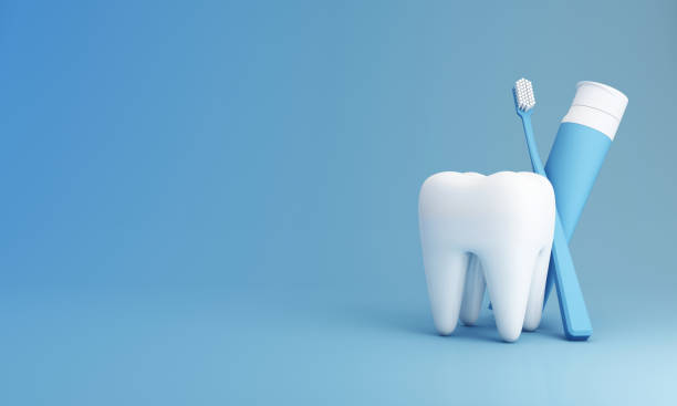 weiße zähne, zahnbürste und zahnpastatube zur produktpräsentation isoliert auf blauem hintergrund, im konzept der mundgesundheit und zahnpflege und mundpflege. 3d-rendering - toothpaste stock-fotos und bilder