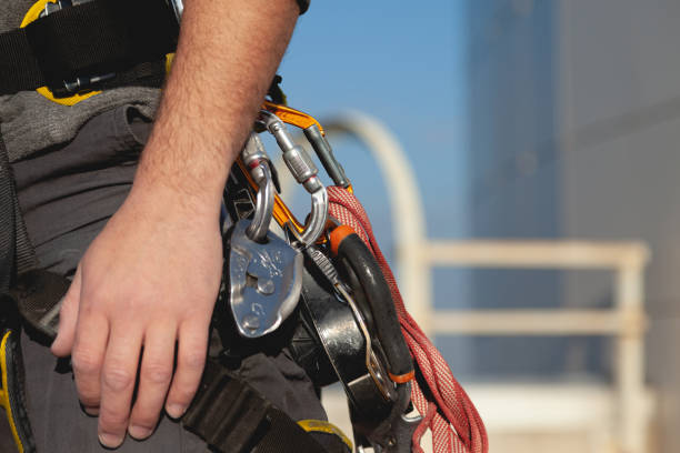 istock Climbing harness with carabiners and a trigger device on the man 1386512454